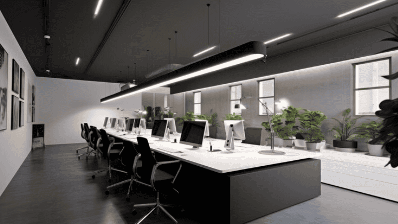A well-lit office with UGR-compliant lights according to international standards