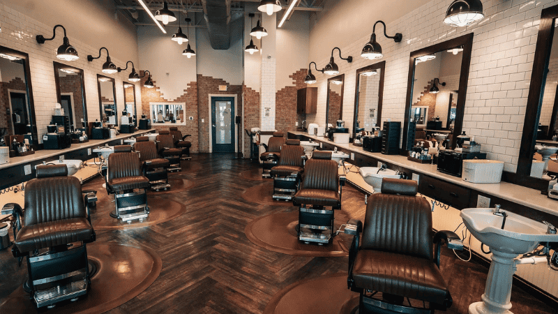 Use accent lights to draw customers to specific areas in your barbershop, highlighting product displays, unique fixtures, and artwork. 