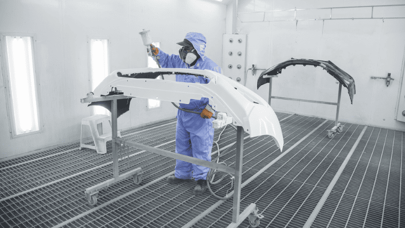 These lights ensure that even if flammable gases or combustible liquids are released during the spraying process, the risk of ignition from the lighting fixtures is minimized. 