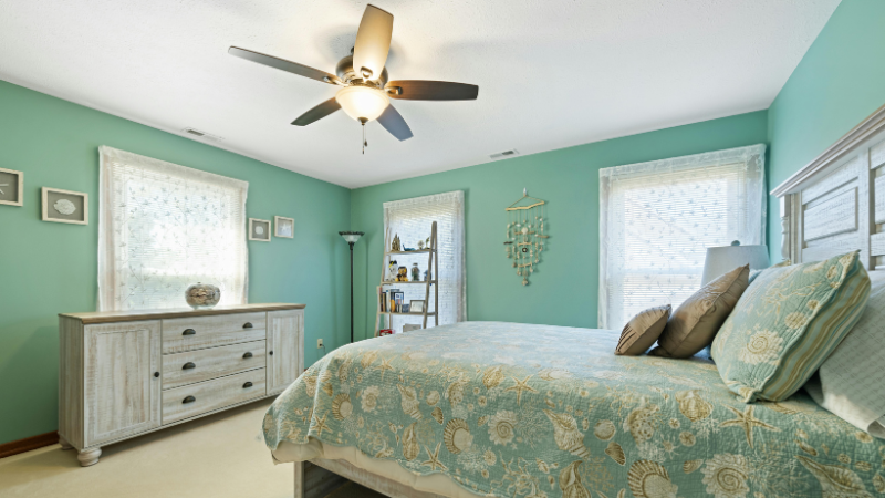 a orange ceiling fan on the bed in the living room