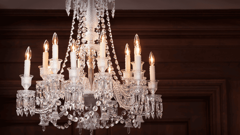 A display of crystal chandeliers made of artificial candles and classical crystals.