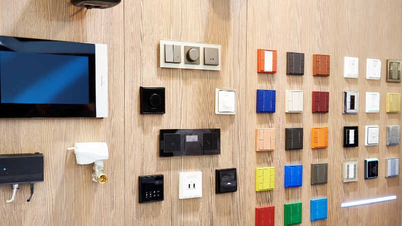 Common Types of Light Switches with various colors on the wall
