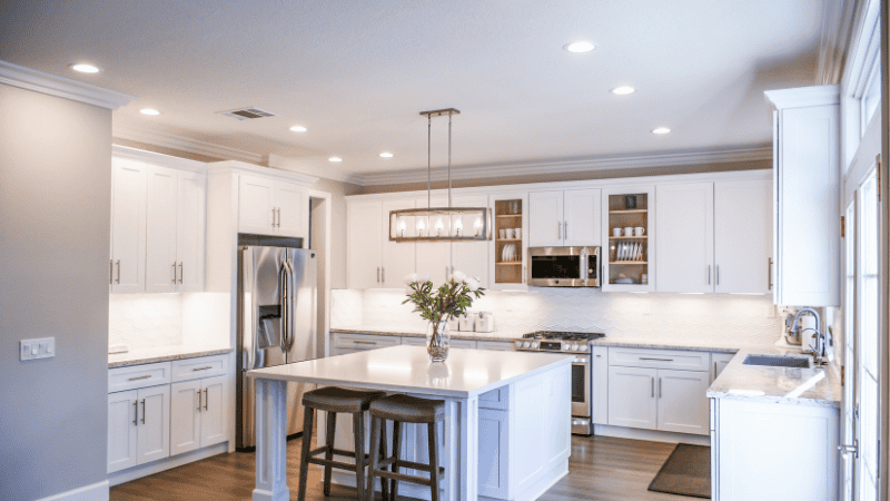 Modern kitchen decorated with a variety of warm white lights