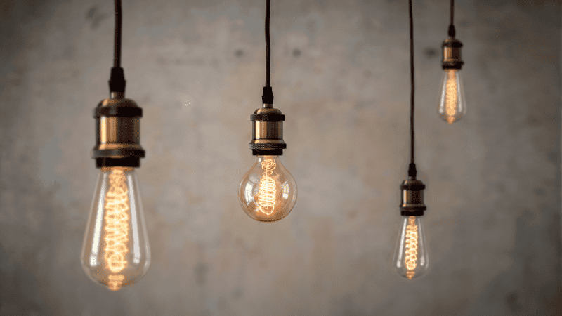 Vintage light bulbs emitting light.