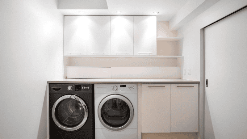 a laundry room with the semi-flush mount lights