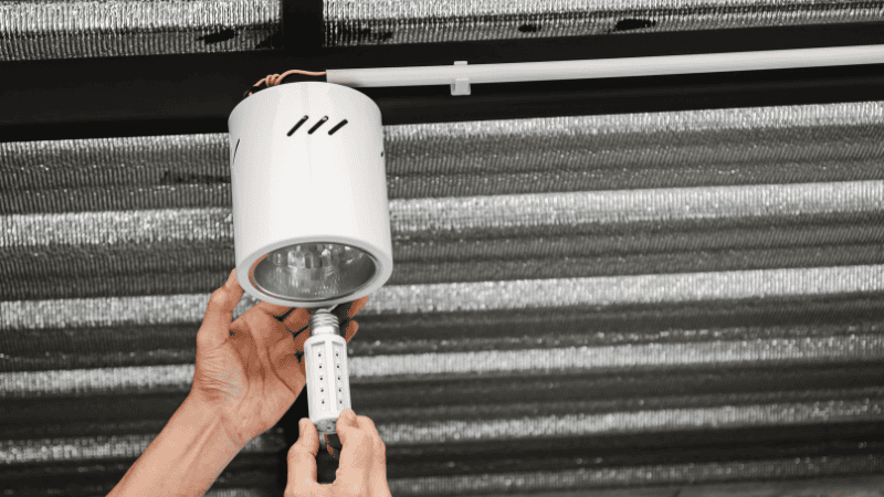 installing an energy-efficient LED bulb.