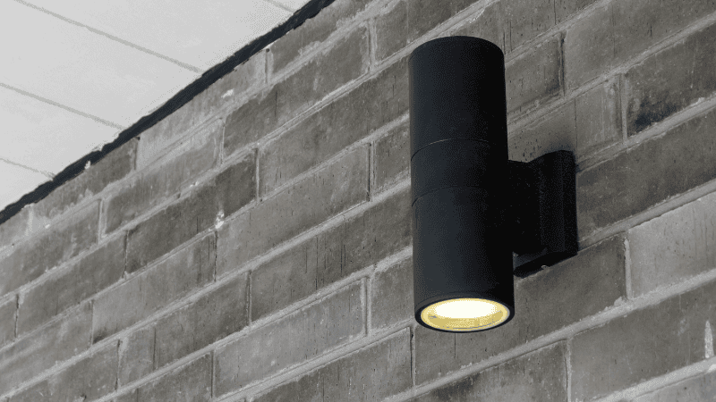 A long tubular black wall lamp display