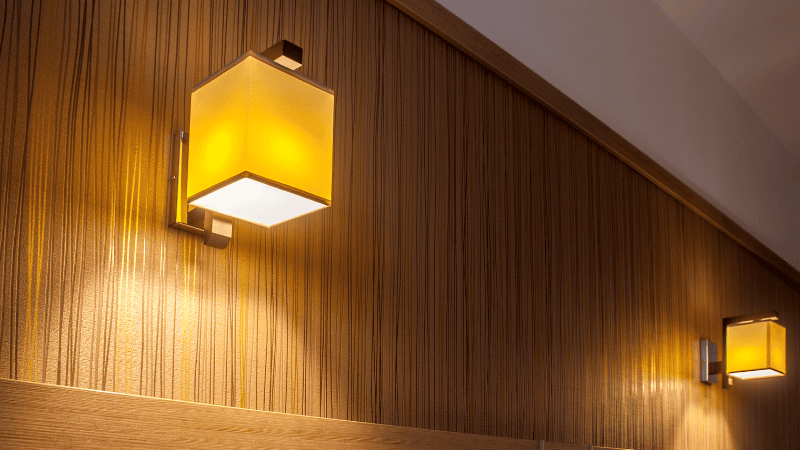 the wall lights with the warm lighting on the indoor room